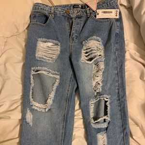 Distressed light wash mom jeans.